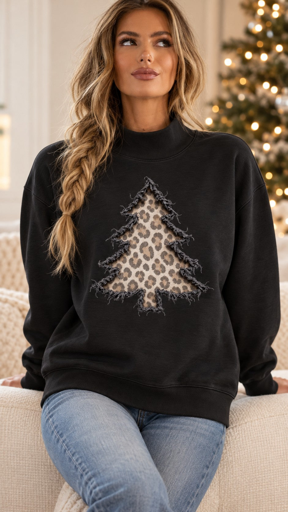 Black oversized mock neck sweatshirt with printed leopard Christmas tree graphic